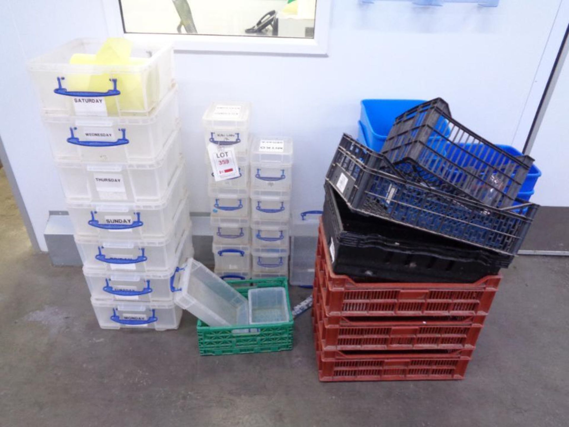 Nineteen assorted clear plastic boxes, assorted crates and eight blue waste bins