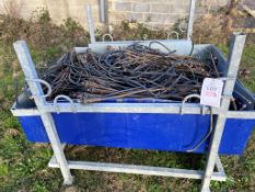 Three galvanised steel stillage crates and associated plastic irrigation