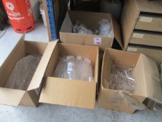 Four boxes of plastic glassware