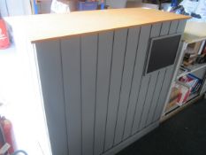 Bespoke timber framed reception counter with under counter roller shutter sliding door cabinet, twin