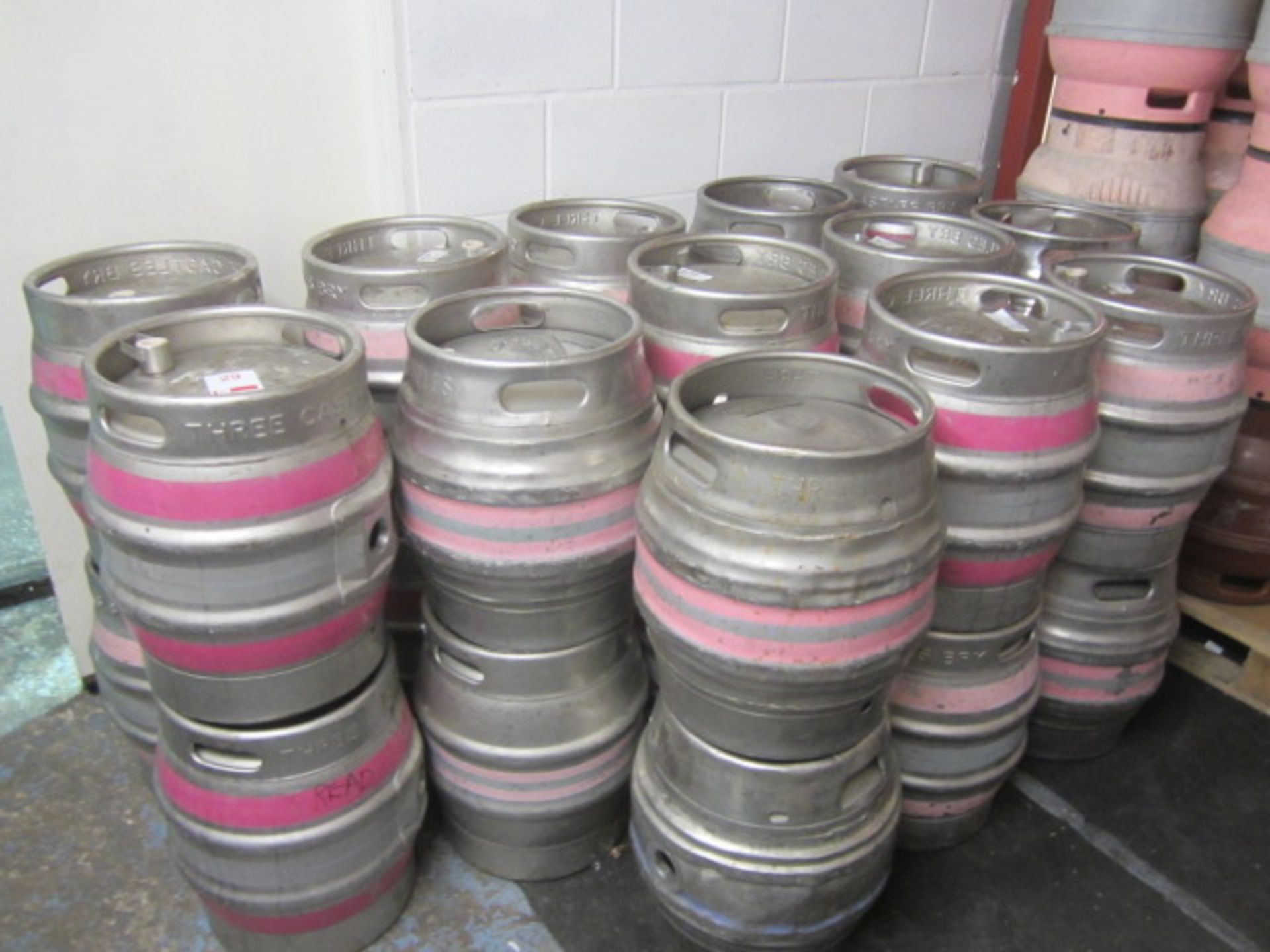 Twenty six 9 gallon metal casks