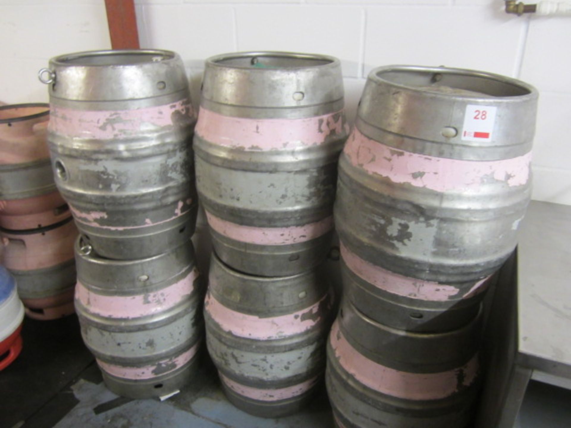 Nine 18 gallon metal casks