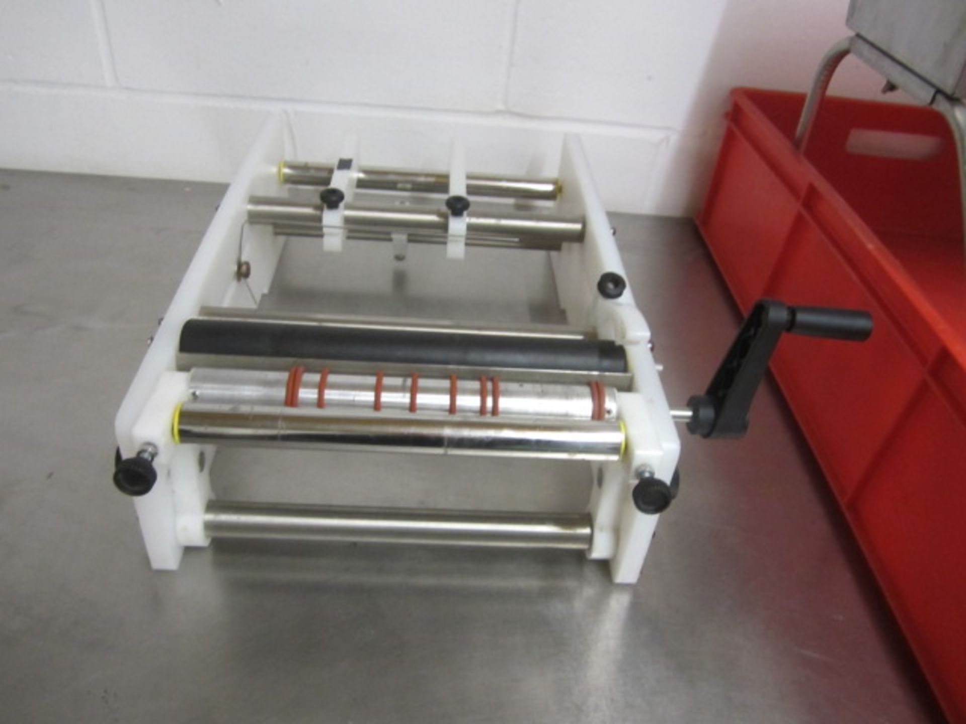 Bench top manual operated label/sellotape applicator