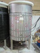 Stainless steel fermenting tank on three legged stand, with filling and drainage taps, 1200mm