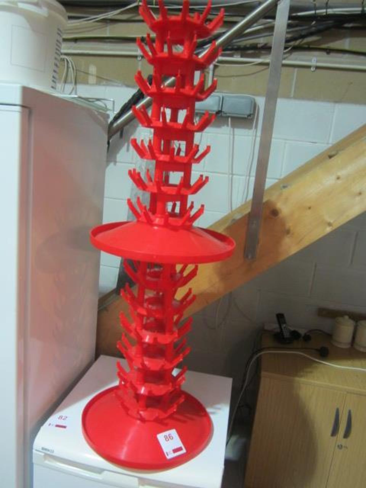 Red plastic product stand