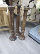 Three wood candle holders, approx. height 600mm