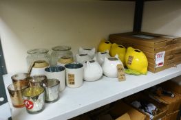 Contents of shelf to include; chopping boards and storage pots