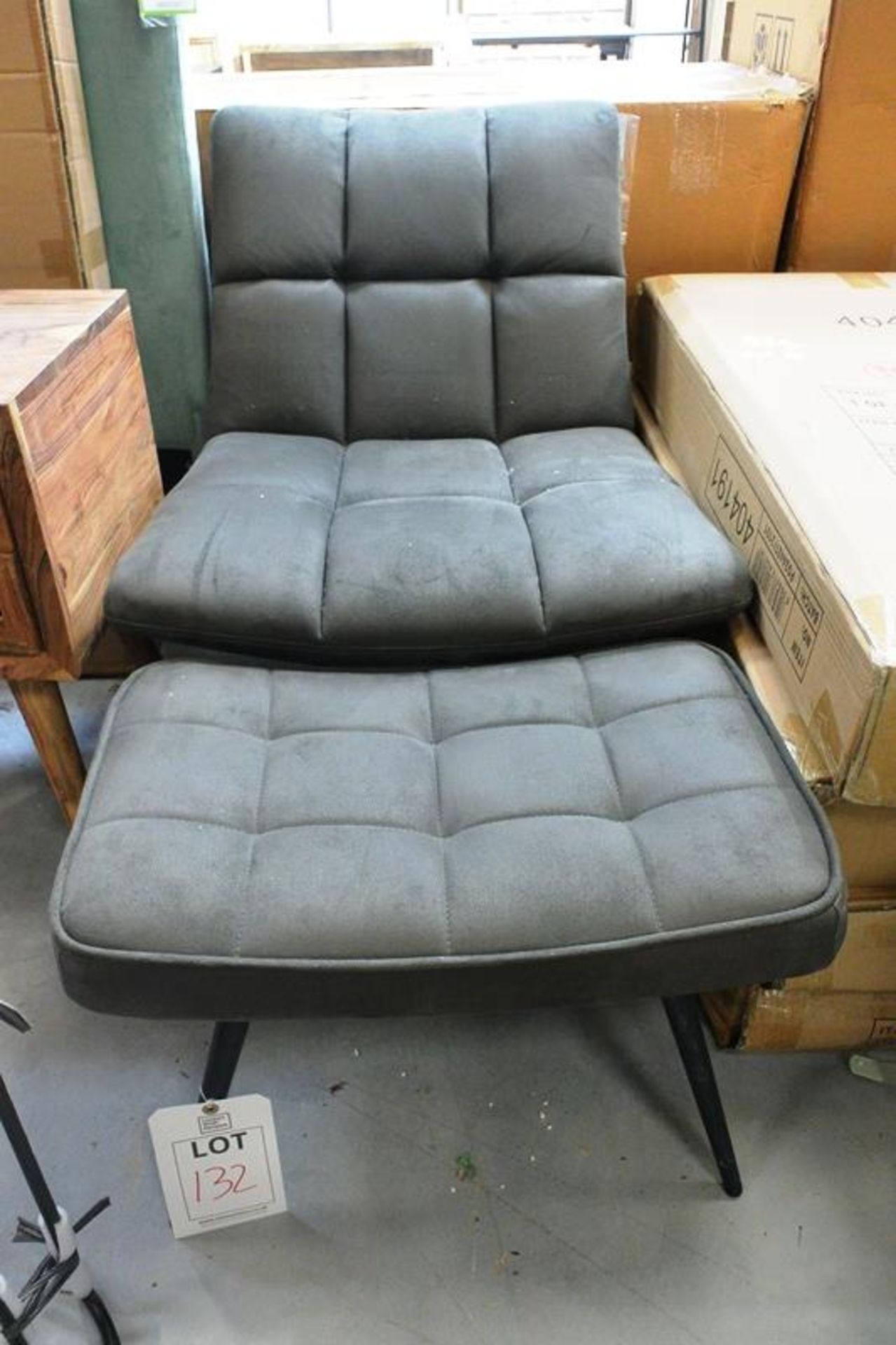 Grey cloth upholstered chair and foot stool