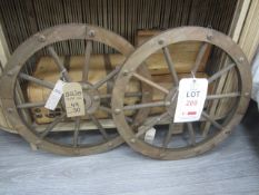Two ornate wall hanging carriage wheels