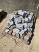 pallets comprising various cobblestones
