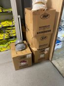 Three boxes of JSP white branded hardhats and one box of JSP grey branded hardhats