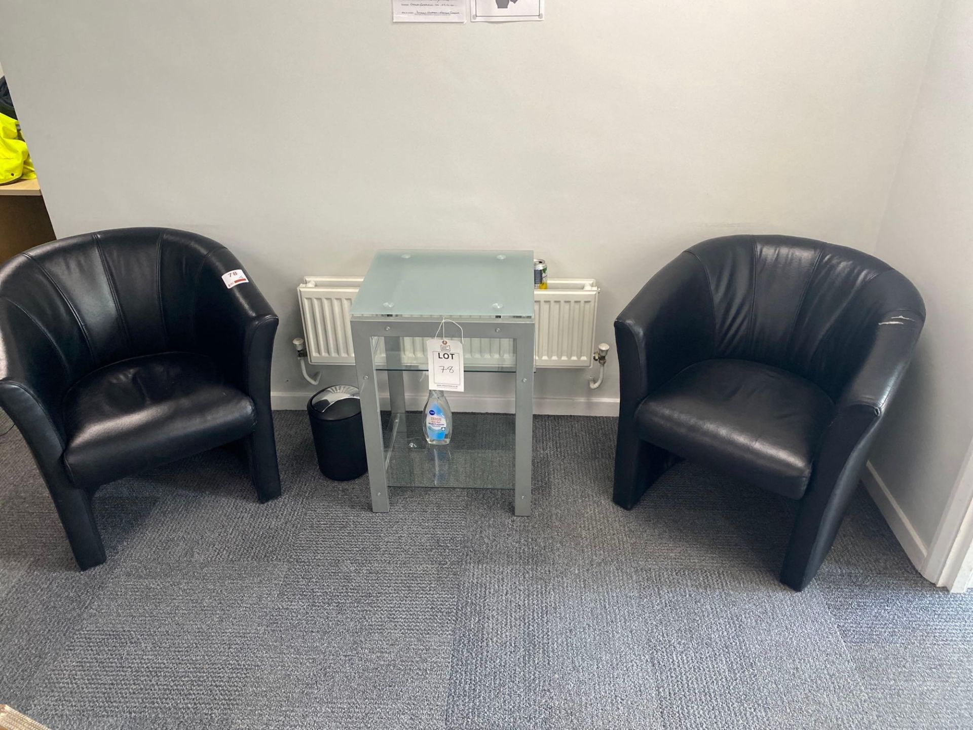 Two Black Leatherette tub chairs and a steel frame glass top display unit