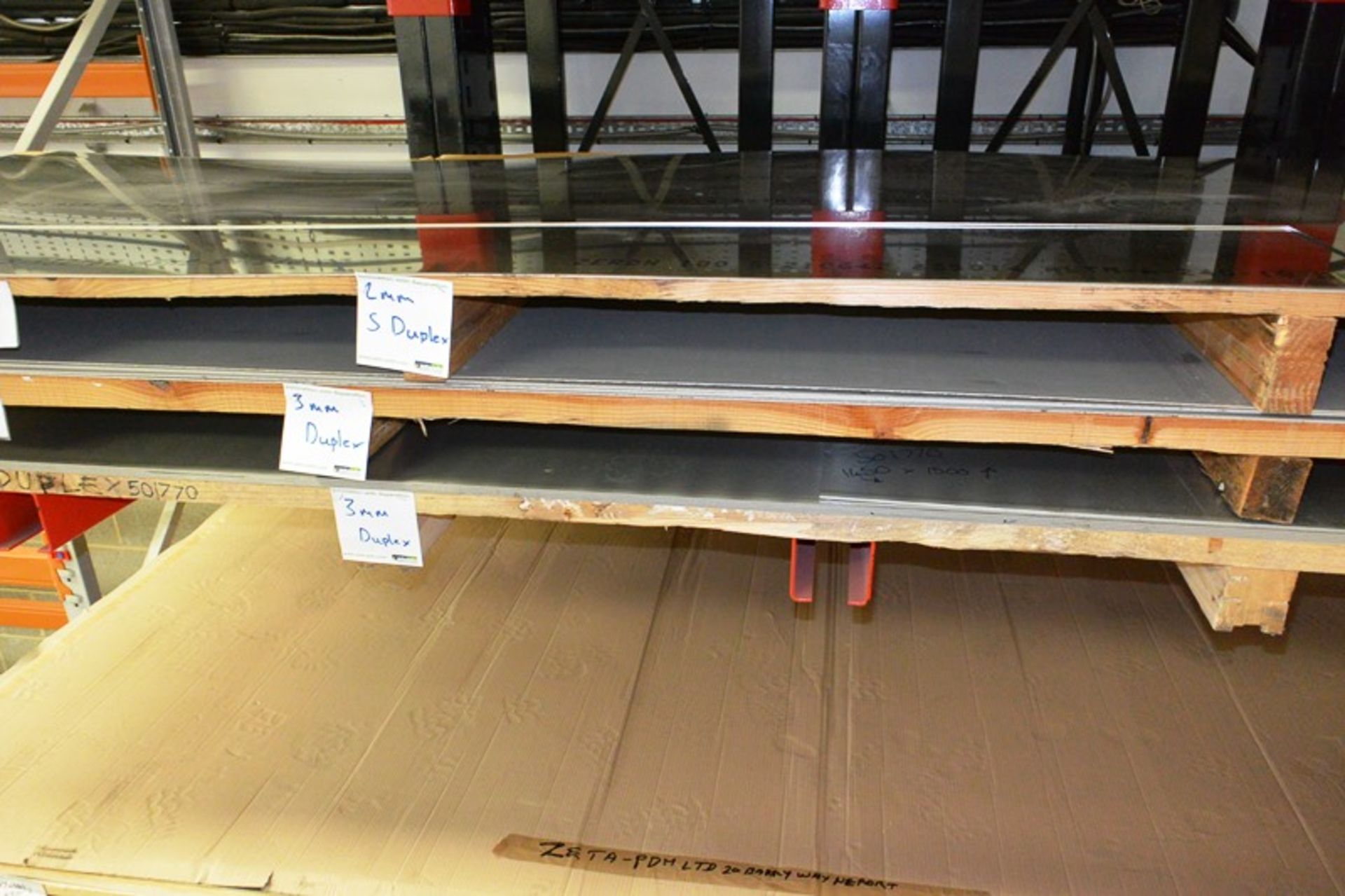 Quantity of assorted sheet stainless steel stock, located on two shelves, including various 2 - 3mm,