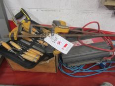 Assorted tools including Quick-Grip bar clamp spreaders, chisels, saw, inverter, etc.