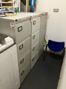 Three 4-drawer metal filing cabinets