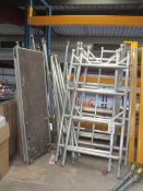 Aluminium tower scaffolding comprising 6 end sections - H 2.1m x 900mm, 14 approx. struts, 4 wheels,