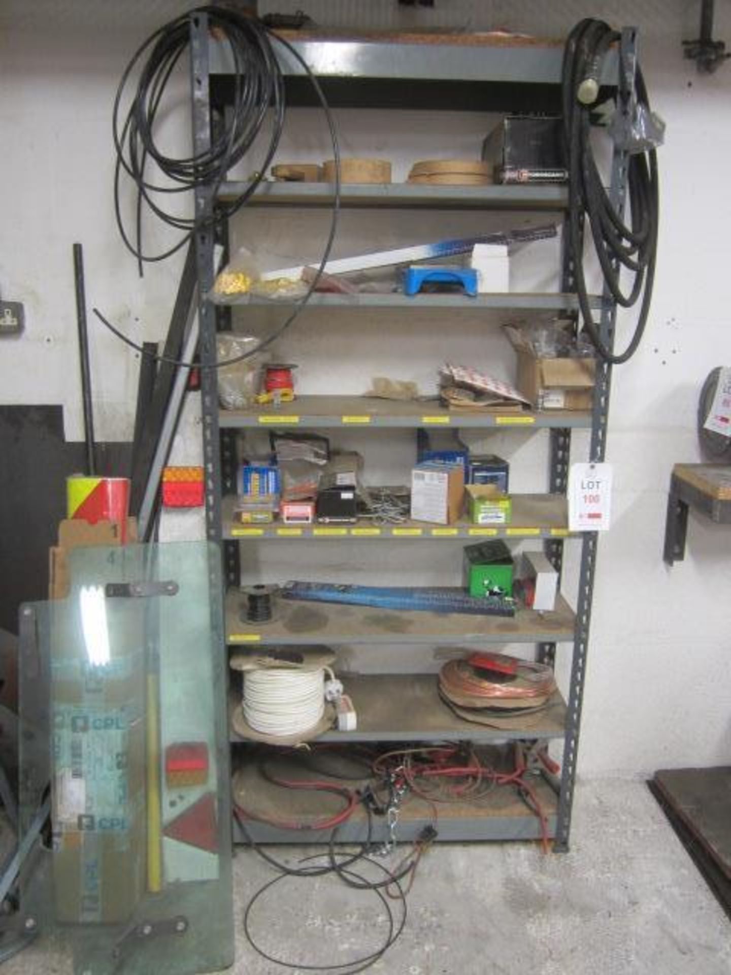 Rack with contents including wood screws, two reels of electrical wire, cable ties, etc.