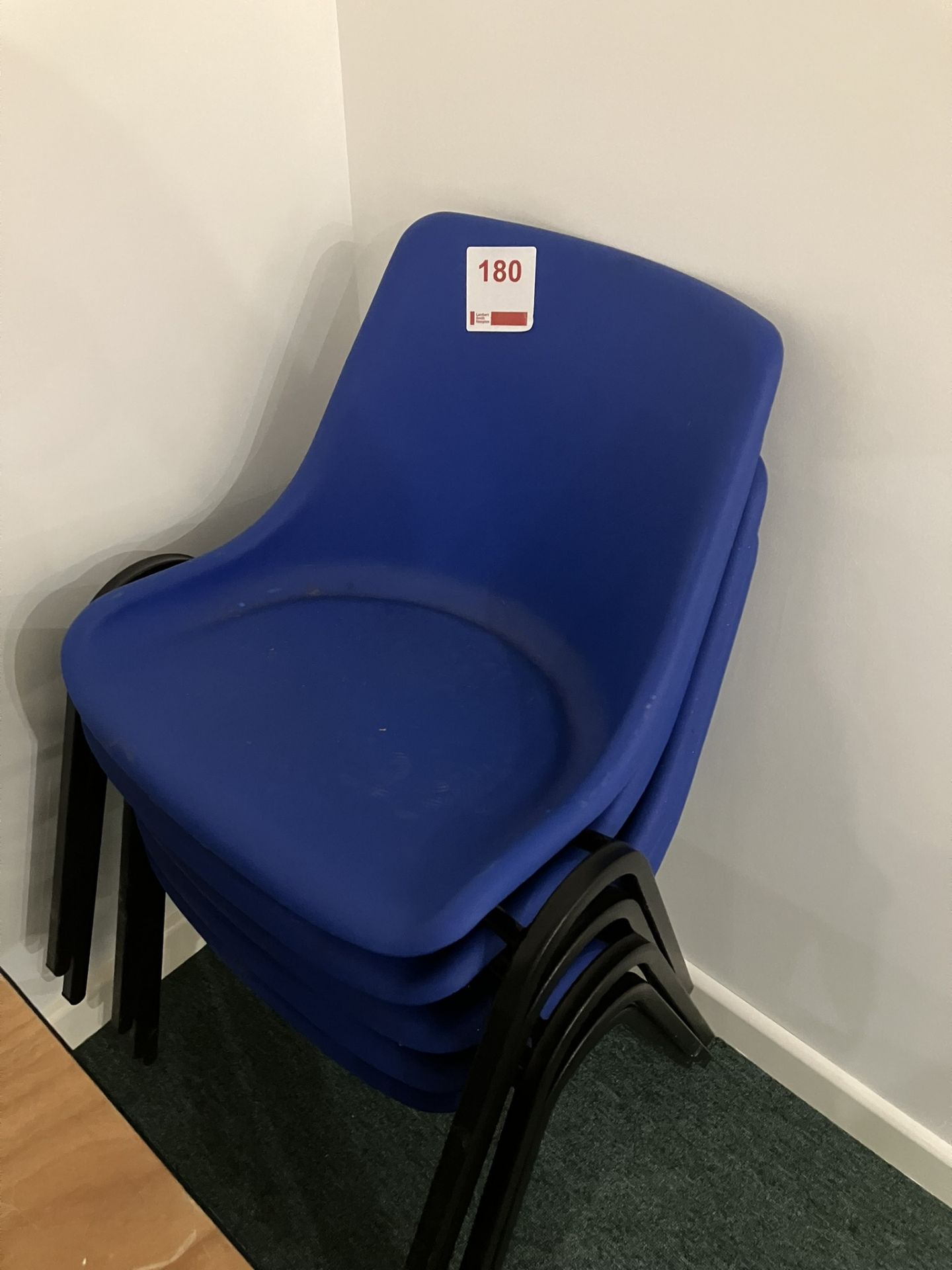 Six plastic chairs and blue upholstered chairs