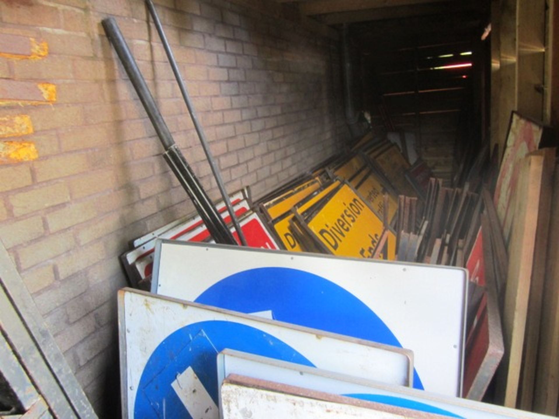 Large quantity of assorted road signs and sign frames, as lotted