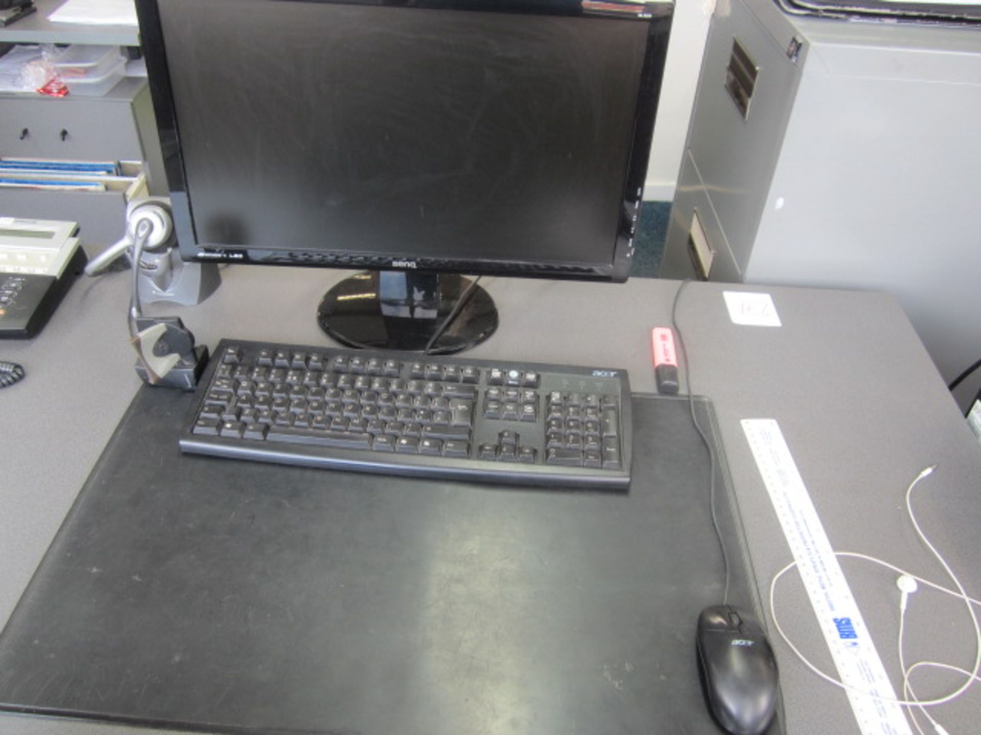 HP Elitedesk computer system with flat screen monitor, keyboard and mouse