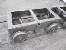Five rail mounted steel framed transport trollies, rail width 700mm, steel frame Size 635mm x