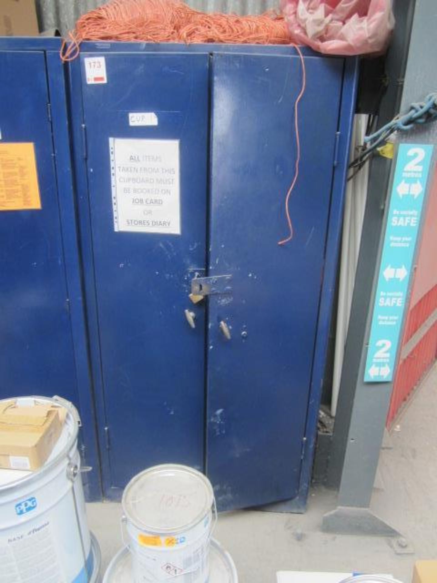 Blue twin door steel storage cabinet and assorted miscellaneous contents to include fuses, cutting