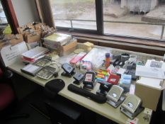 Quantity of assorted office sundries including rulers, electric stapler, calculators, hole