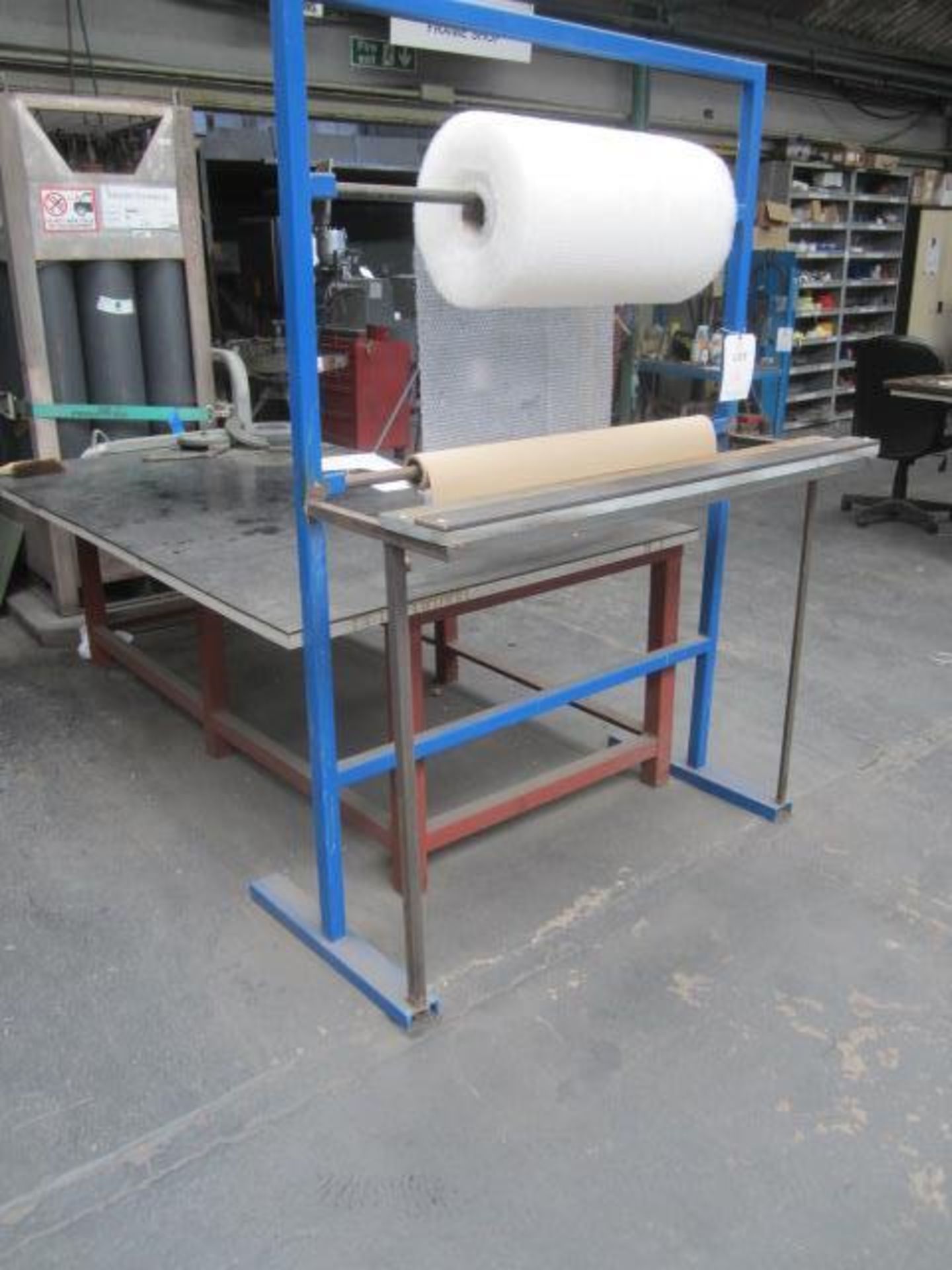 Steel framed rubber topped workbench, 2100 x 1200mm and a steel framed triple shelf storage rack,