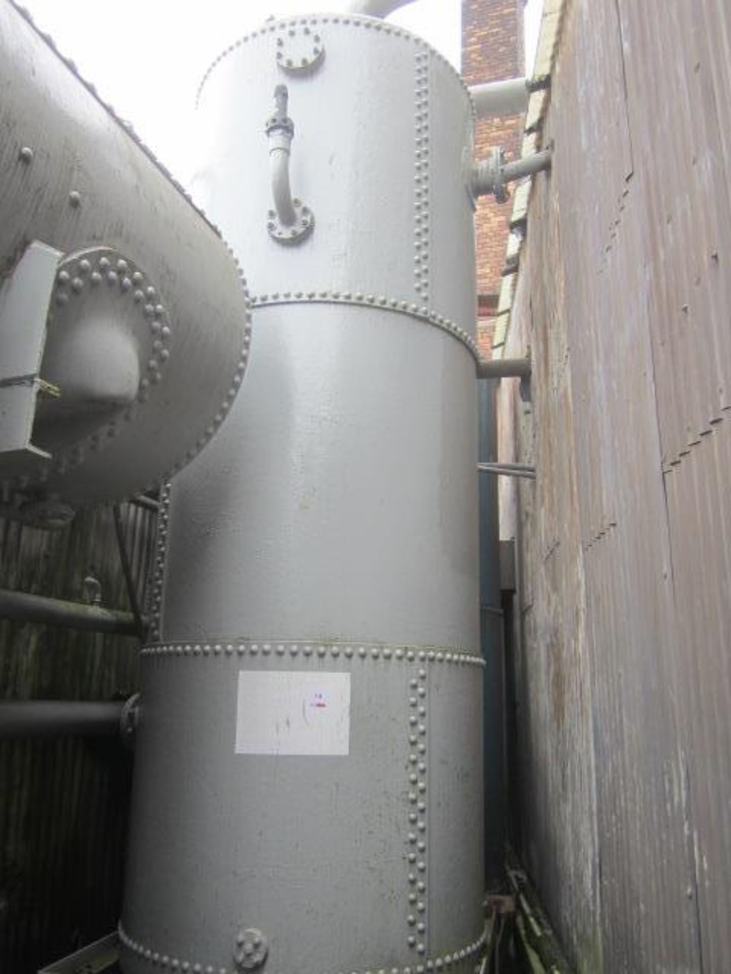 Unnamed welded air receiver mounted on steel platform, approx. 5m height