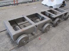 Five rail mounted steel framed transport trollies, rail width 700mm, steel frame Size 635mm x