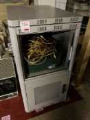 Unbranded server cabinet and box of cables
