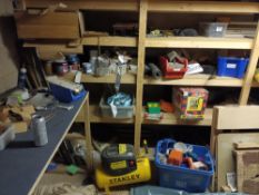 Contents of woodworking garage comprising Stanley compressor, sheeting, various mastics and