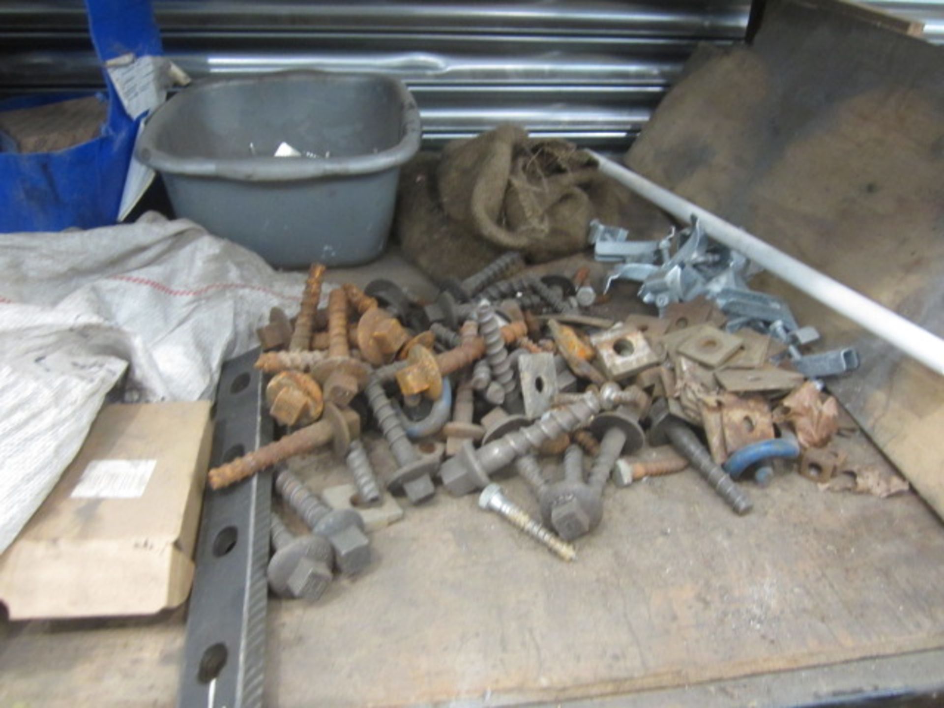 Contents of bay of racking including steel profiles, heavy duty bolts, metal clips etc., as lotted - - Image 10 of 19