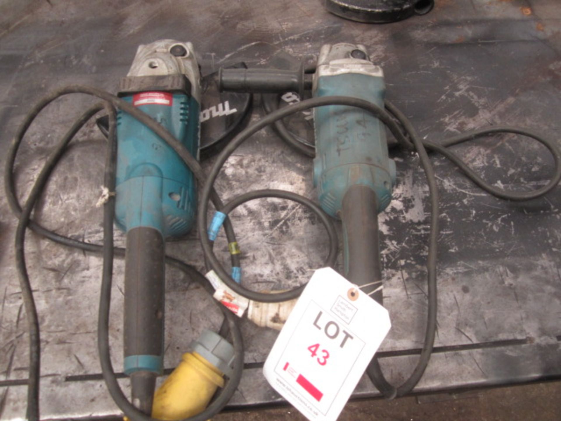 Two Makita 9" angle grinders, 110v