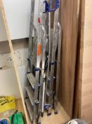 Three various aluminum A-frame step up ladders
