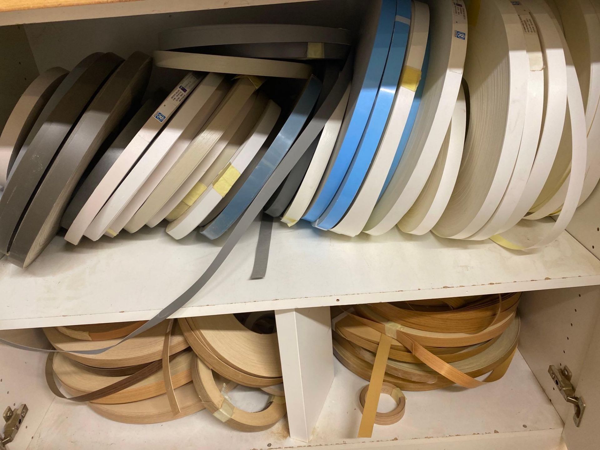 Contents of 12 shelves and four cupboards to include large quantity of edge banding material and adh - Image 4 of 8
