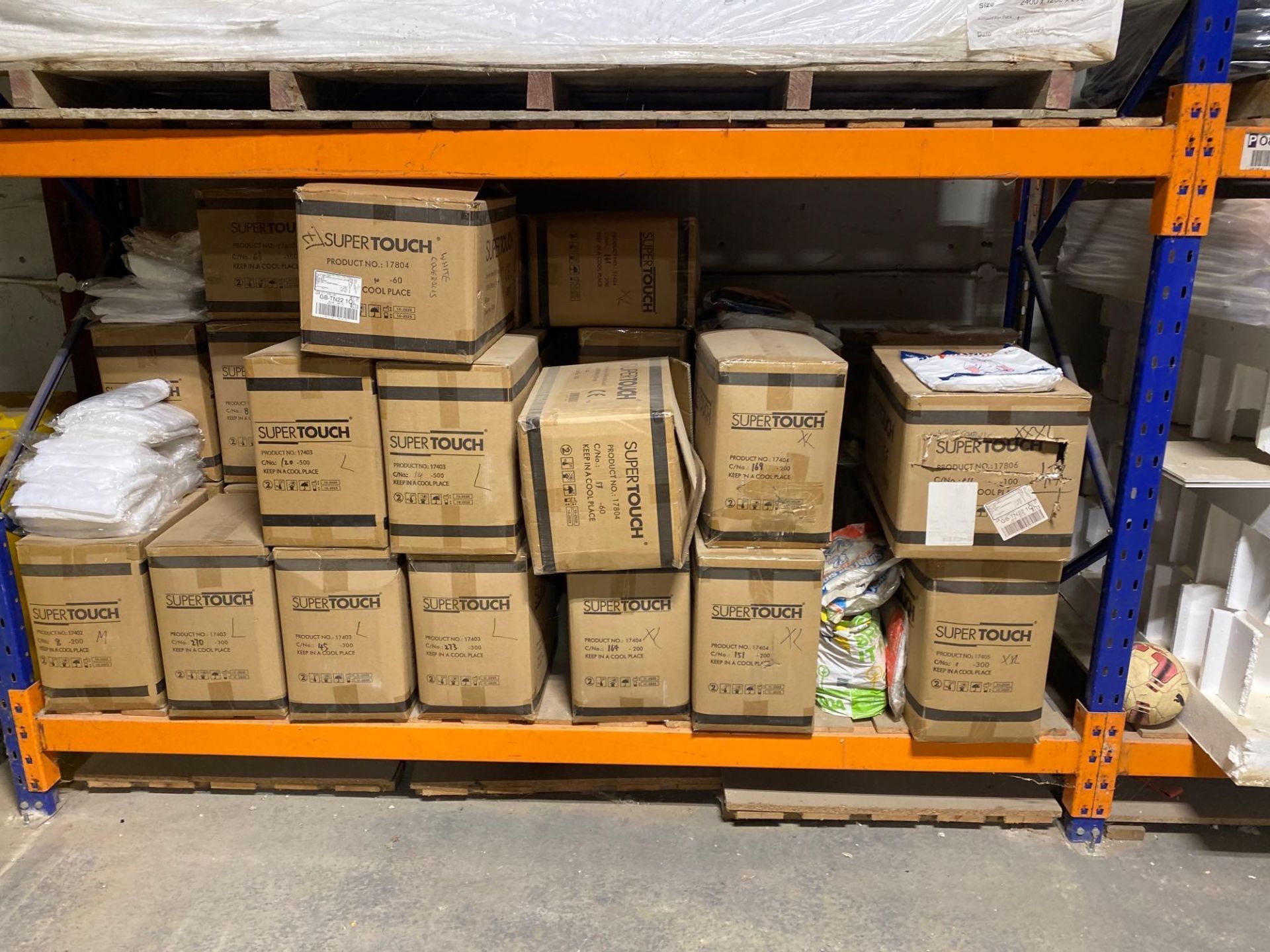 Approximately 30 boxes of unused super touch coveralls type 5–6, size is medium large and extra larg