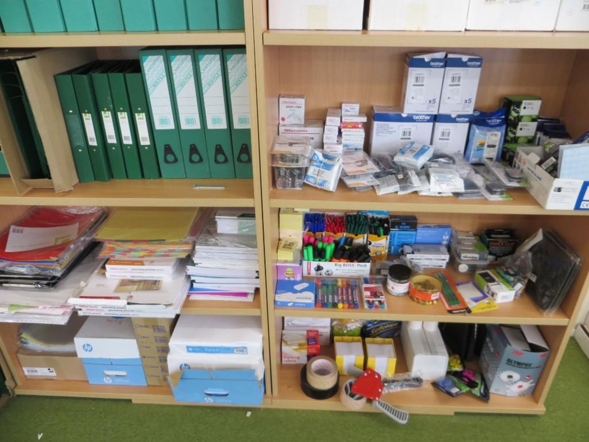 Two light oak veneer 5 shelved bookcases c/w stationery to include printer inks, pens,pencils, marke