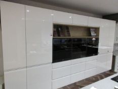 Mackintosh integral Gloss showroom display kitchen comprising of: - 3 x integrated Caple ovens,
