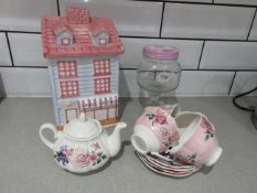 Ceramic cookie jar, tea pot, cups and saucers