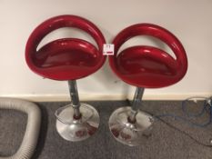 Two red lowback dining chairs