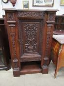 Oak corner cabinet with floral carvings