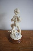 Vintage figurine “Boy with Basket” to wooden plinth