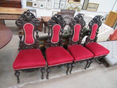 Set of four Jacobean style chairs with two castor wheels to feet