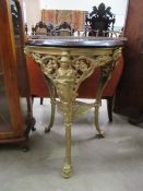Ornate gilt table with mahogany top