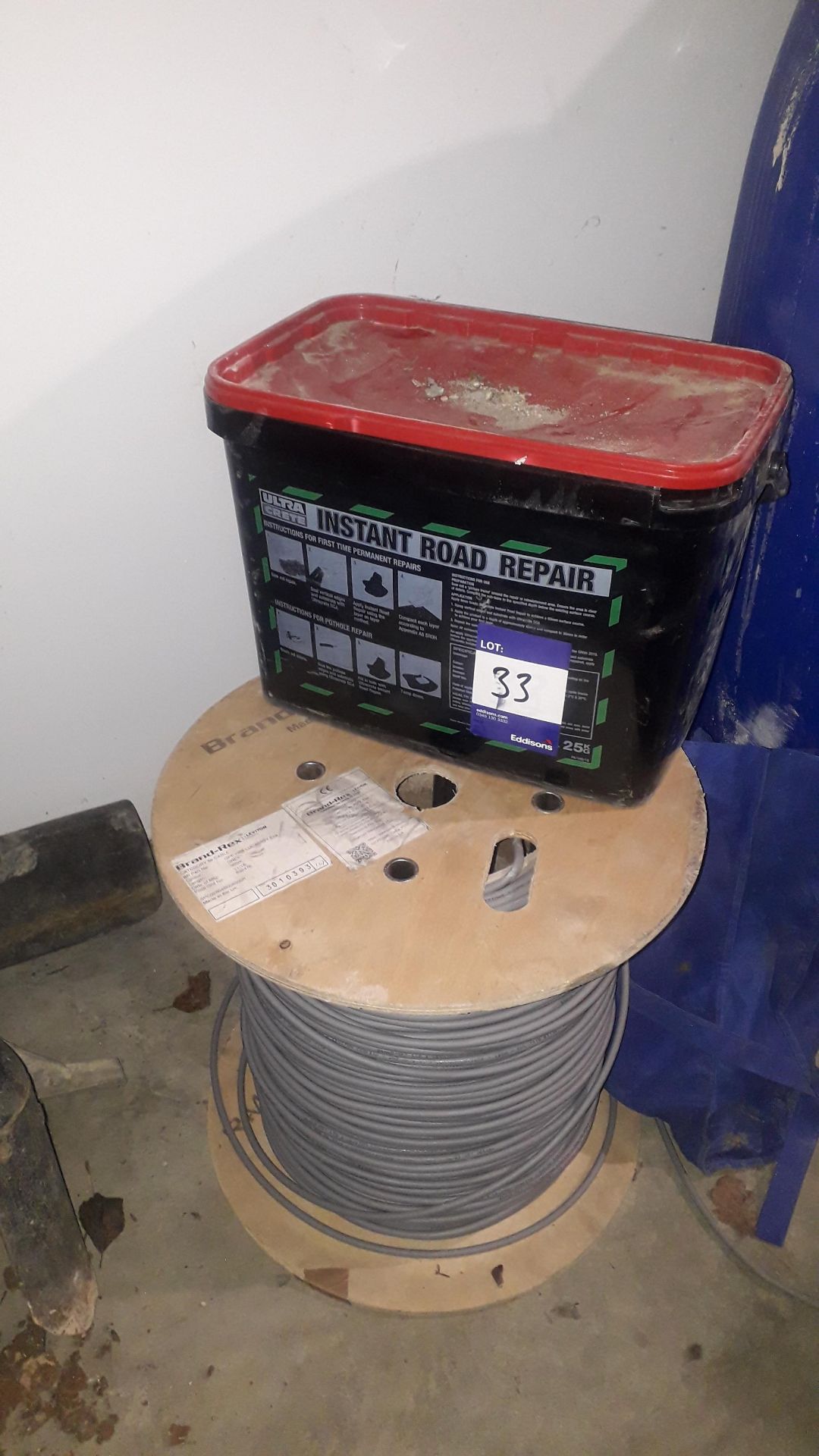 25kg Container of Ultra Crete Instant Road Repair and a Part Used 500m Cat 5e Cable Reel Located