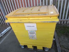 A yellow taylor continental 1100 waste bin "forkliftable"