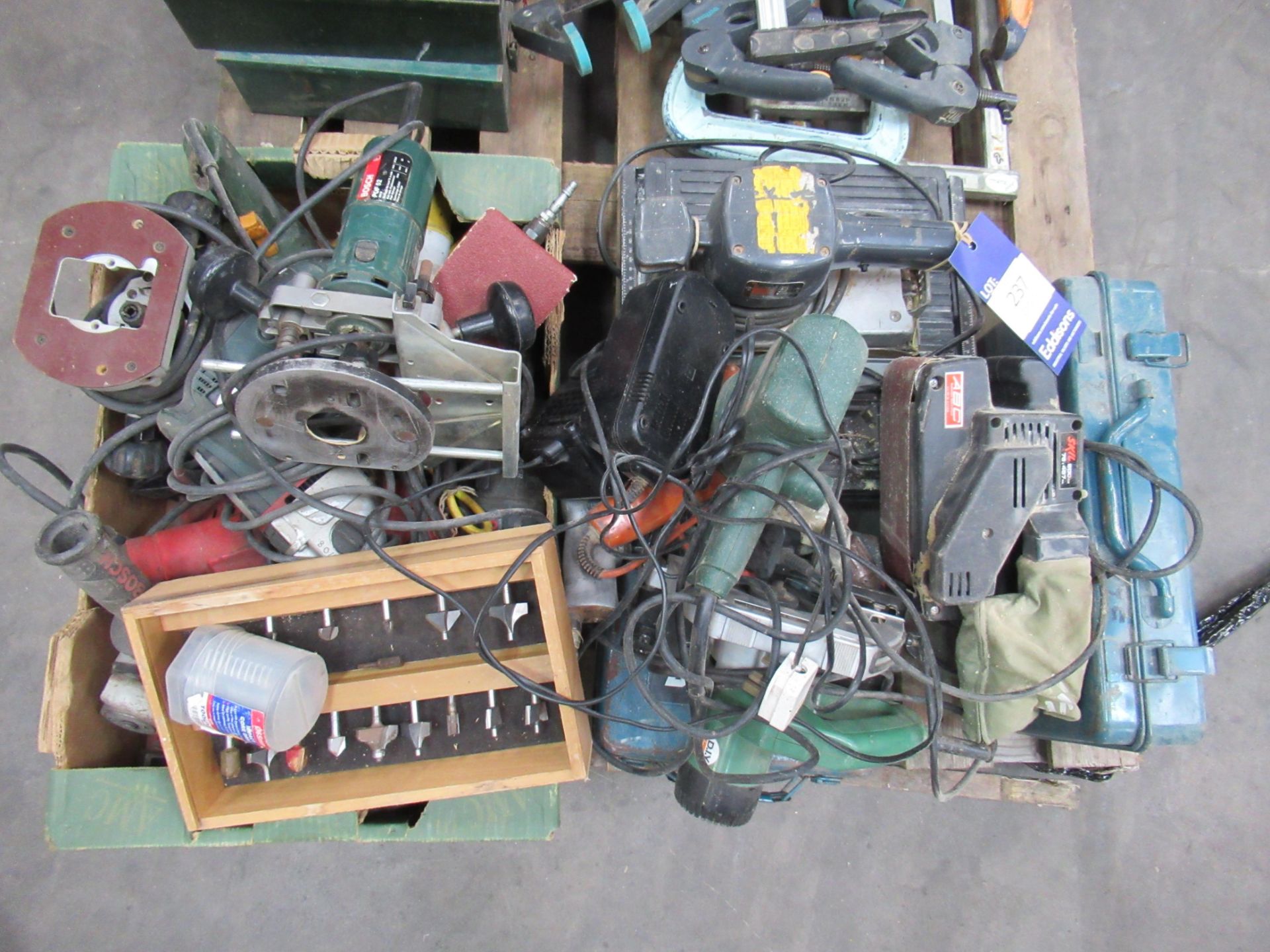 Selection of power tools including cordless, 110V and 240V.