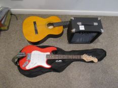 An encore acoustic guitar and a squire mini fender electric guitar etc