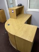 Curved reception desk, fridge, coffee table, 2x chairs & an artificial plant